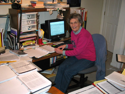 Mary at work in cluttered office